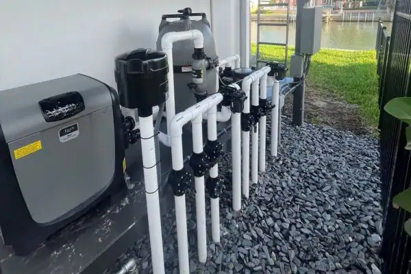 Pool equipment and filtration system installed outdoors near a pool.