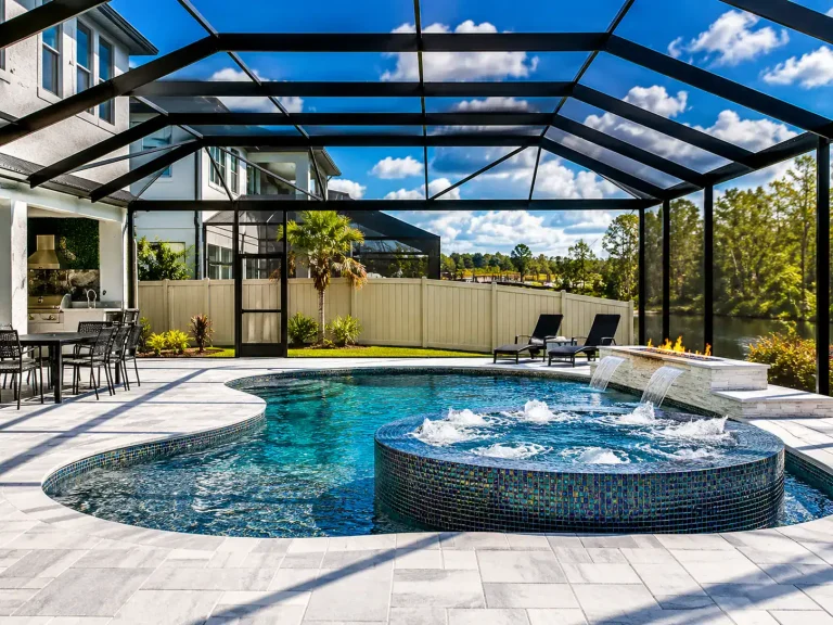 Beautiful screened pool enclosure with hot tub and lounge area in Tampa.